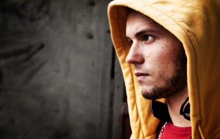 Profile of hooded Young man looking off